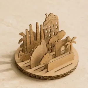 Diorama de cartón automontable con siluetas arquitectónicas.